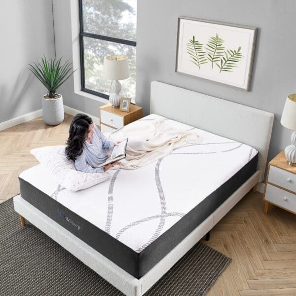 Woman lying on a mattress reading a book